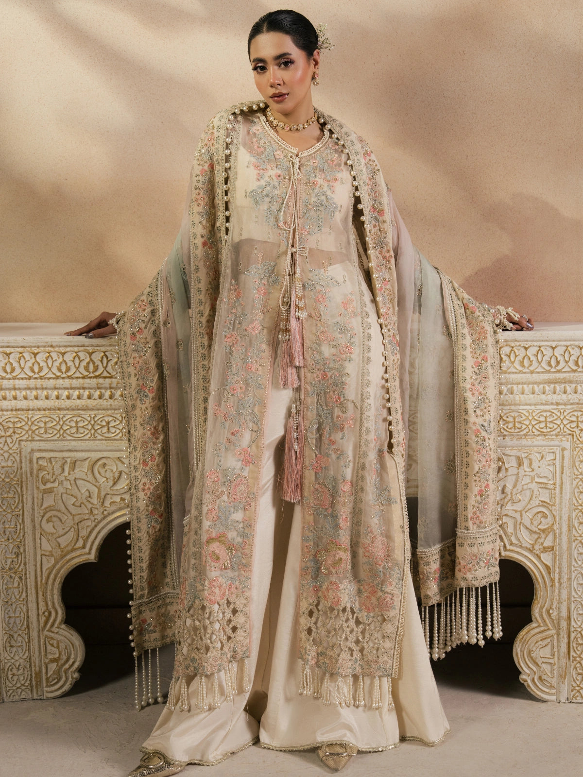 Beige embroidered ethnic dress with soft pink and sage floral details