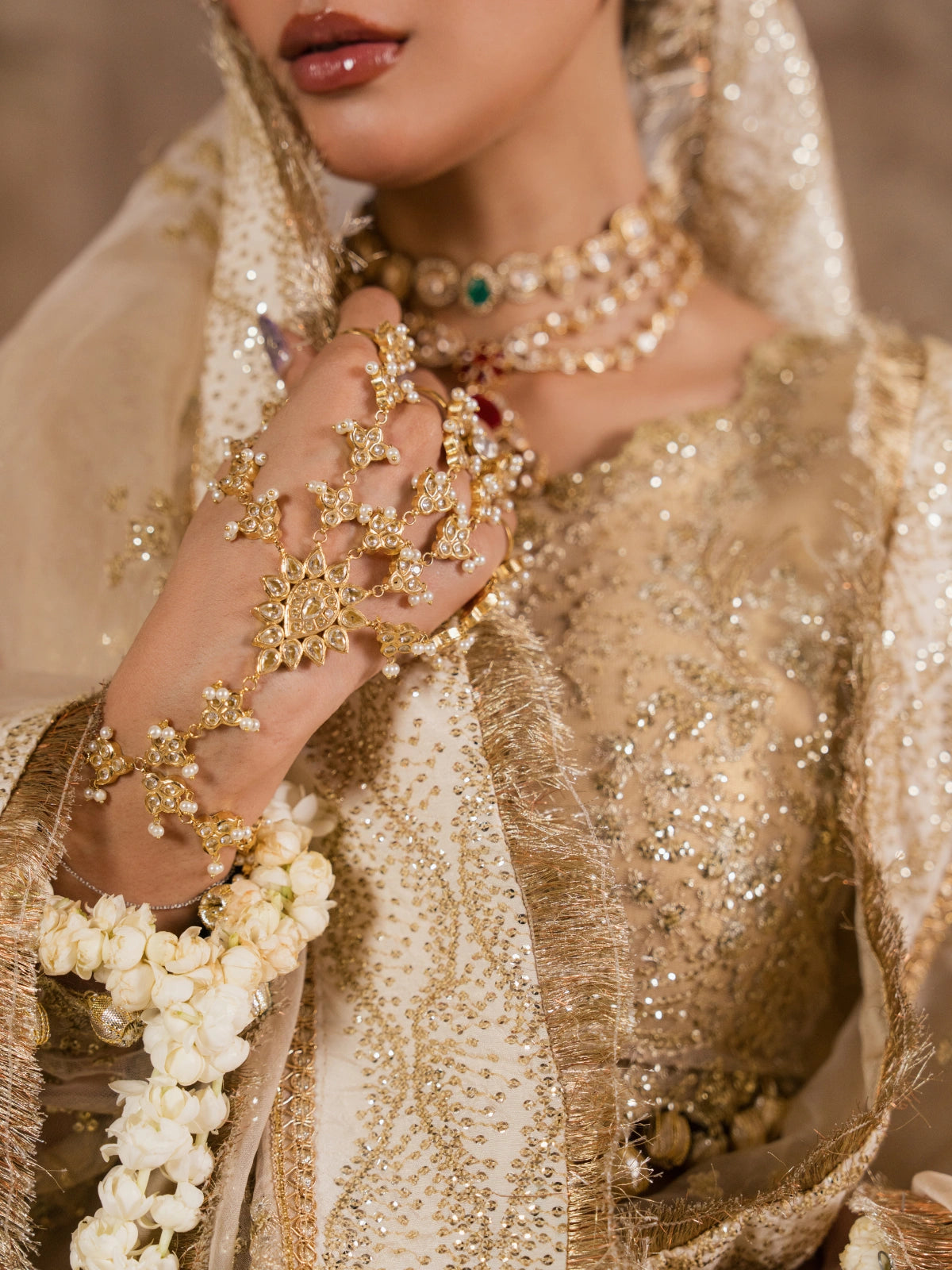 Close-up style view of an embroidered golden lehenga and dupatta