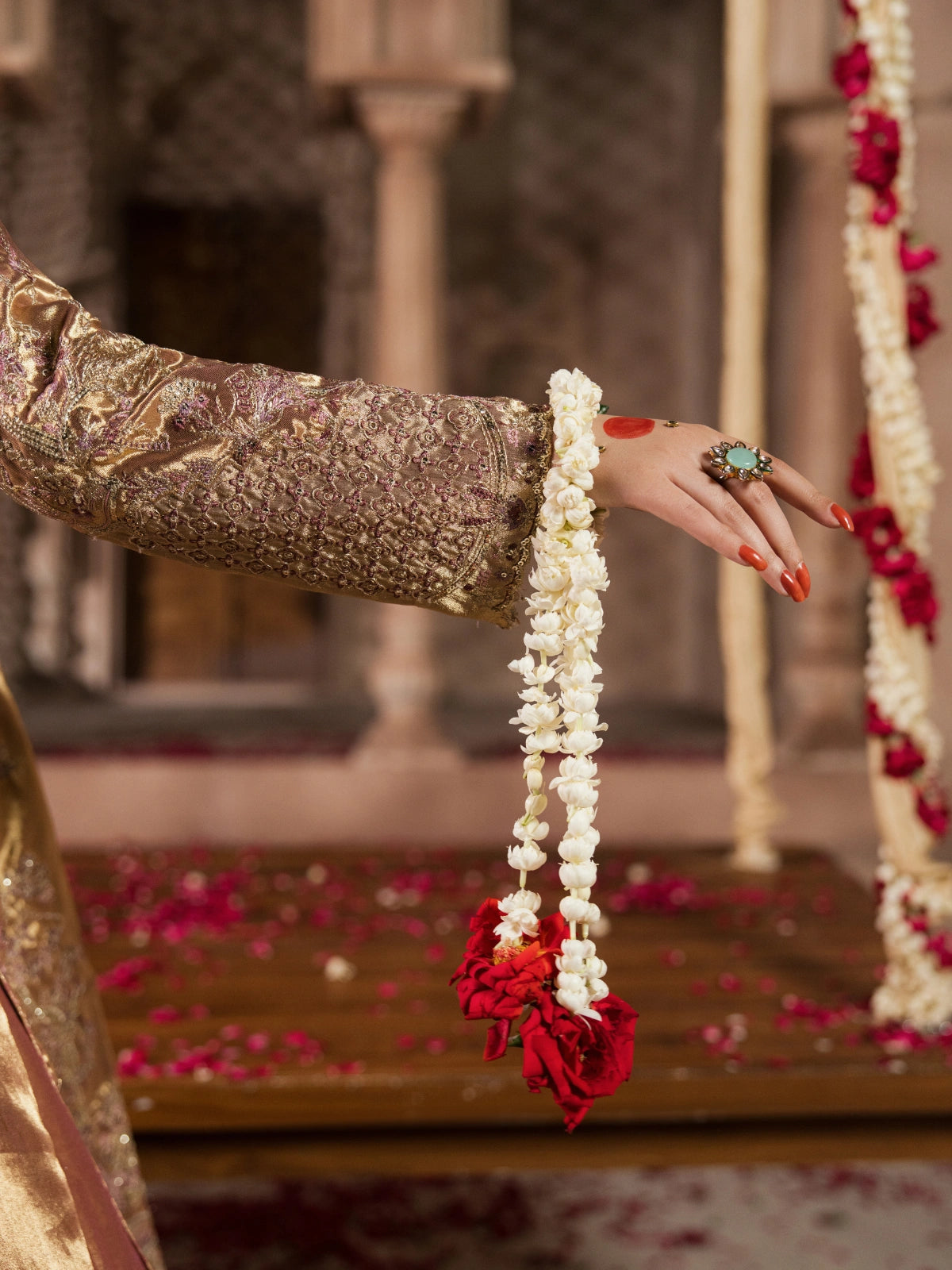 Golden embroidered gharara styled with traditional bridal jewelry