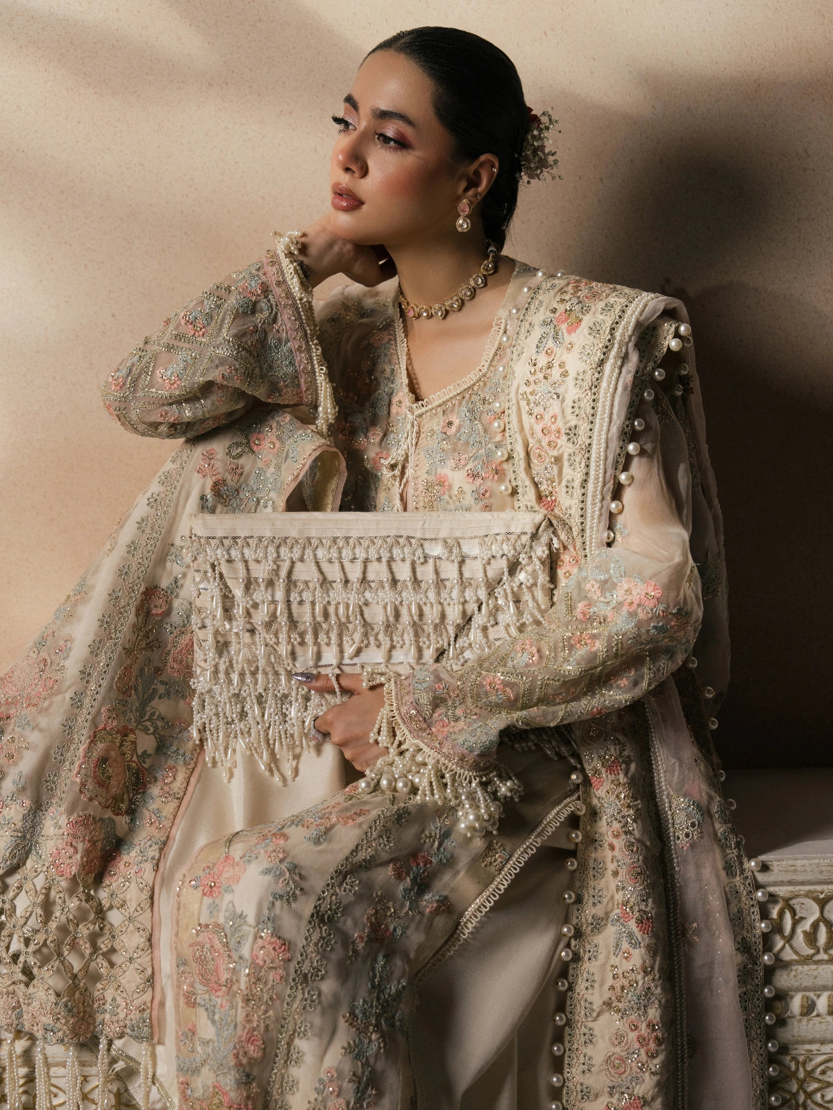 Luxury traditional dress with delicate floral patterns and tassel details