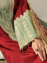 Model wearing a maroon embroidered 3-piece Pakistani outfit with a mint green and maroon dupatta.