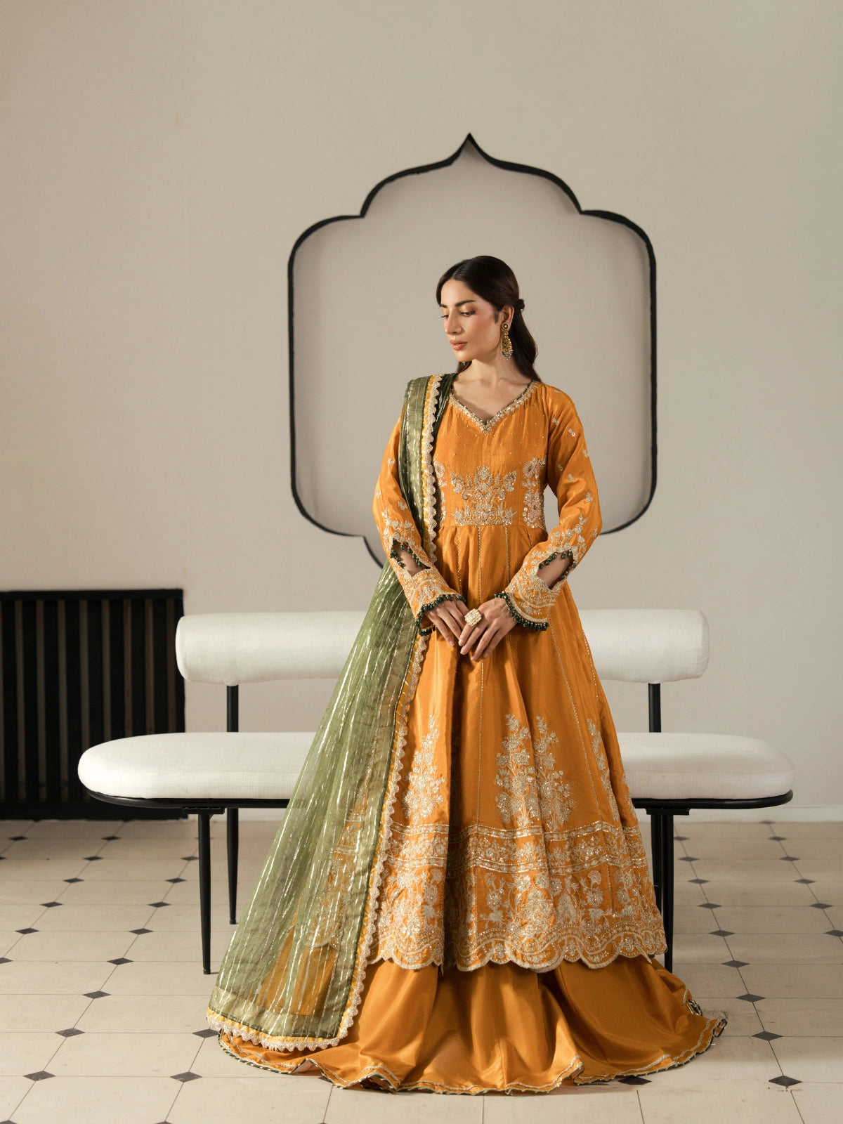 Mustard orange embroidered maxi dress paired with an olive green dupatta.