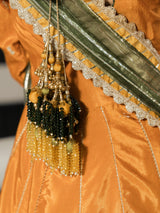 Olive green dupatta with gold-toned detailing styled over an orange maxi dress.