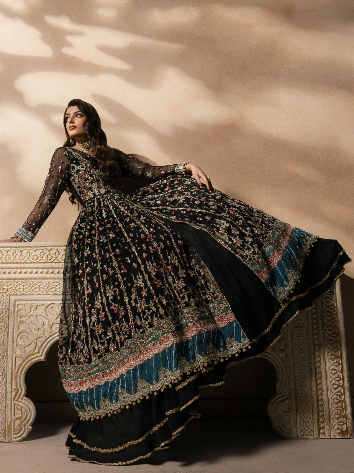 Luxury black Pakistani bridal dress with intricate traditional embroidery