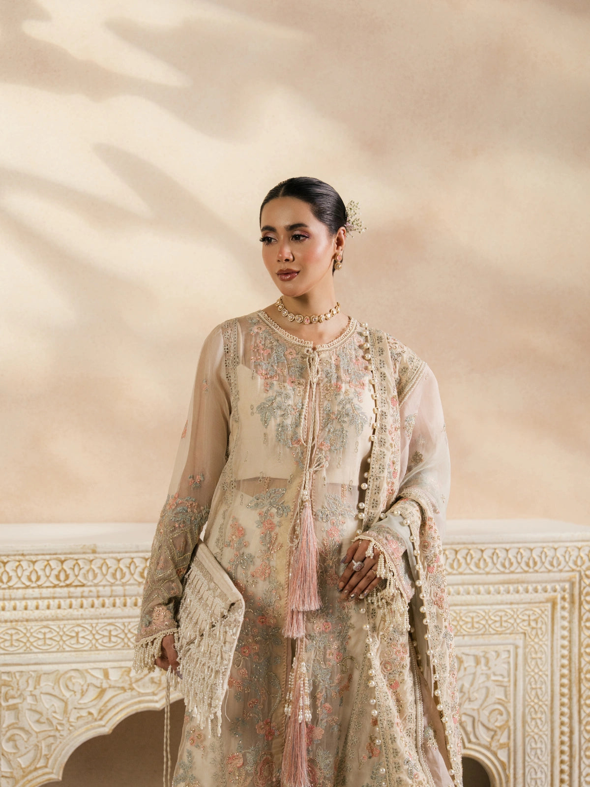 Elegant Pakistani formal wear with pastel floral embroidery