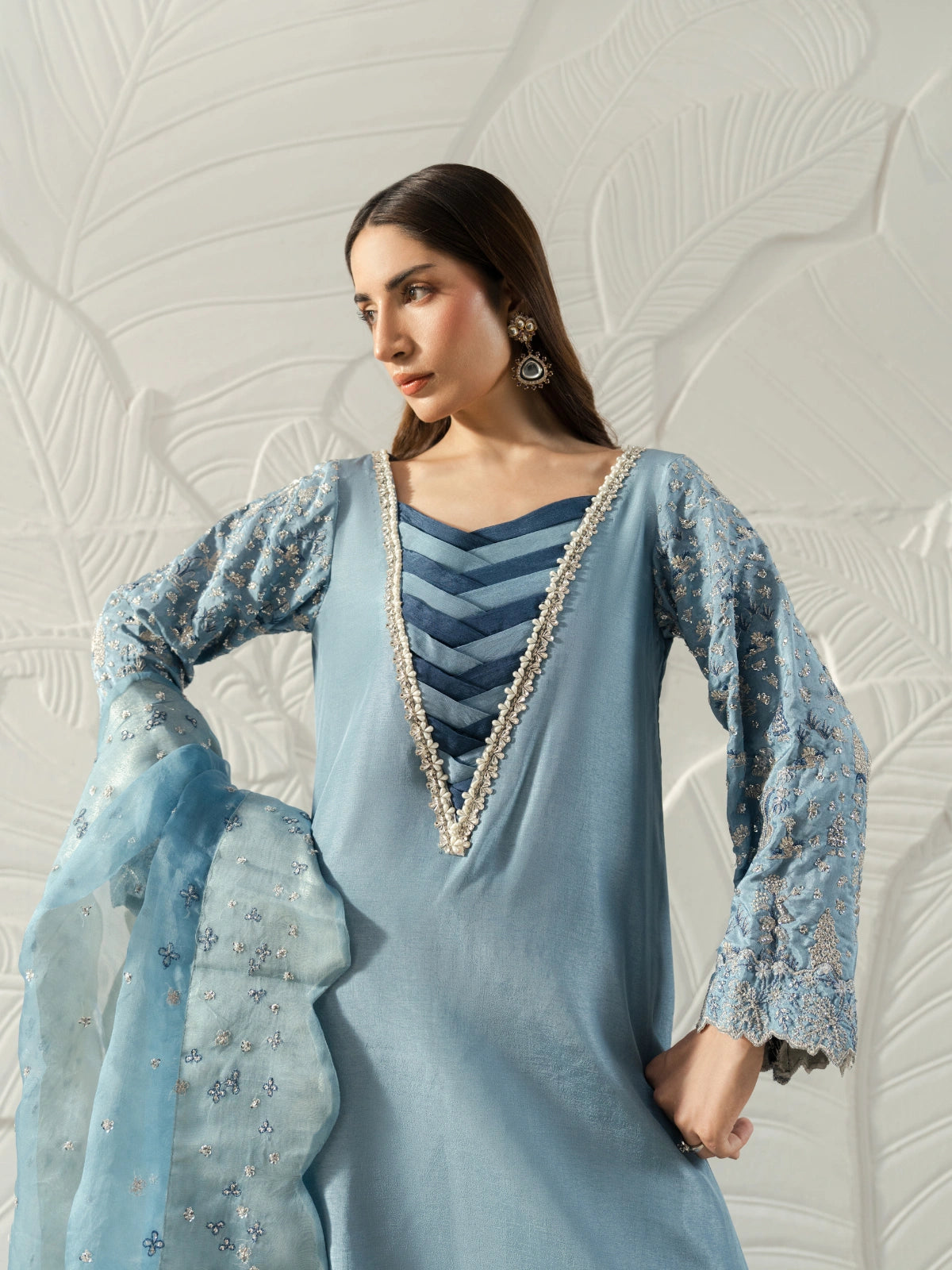 Sky blue semi-formal women's outfit styled with a long shirt and a sheer embroidered shawl.