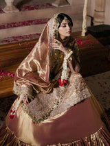 Traditional golden bridal wear with a richly embroidered dupatta