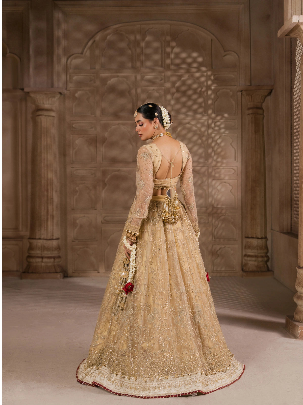 Traditional golden wedding lehenga with heavily embroidered skirt