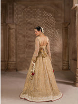 Traditional golden wedding lehenga with heavily embroidered skirt