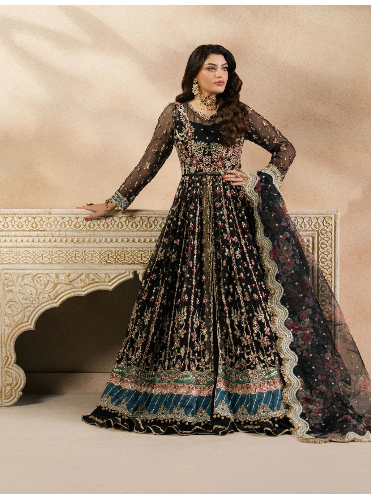 Full-length black bridal outfit with gold embroidery and elegant dupatta