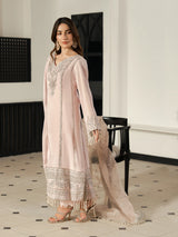 Women's blush pink formal outfit with an embellished neckline and sleeves.