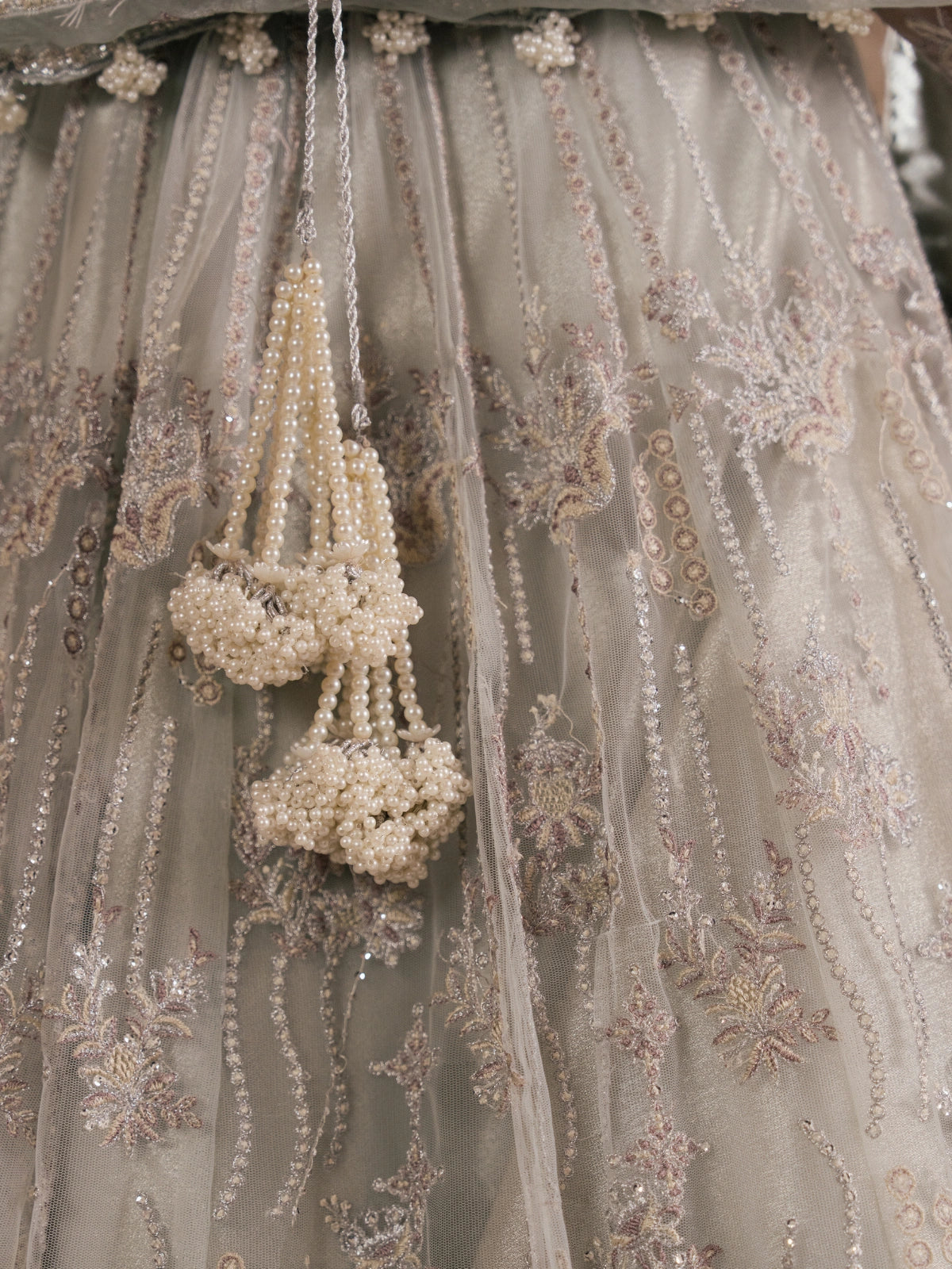 Traditional Pakistani formal wear with a flowing net dupatta