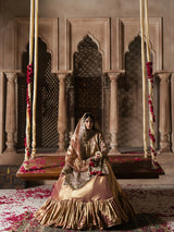 Luxury gold formal gharara with detailed embroidery and a flowing silhouette