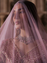 Full-length mauve pink lehenga with contrasting dupatta