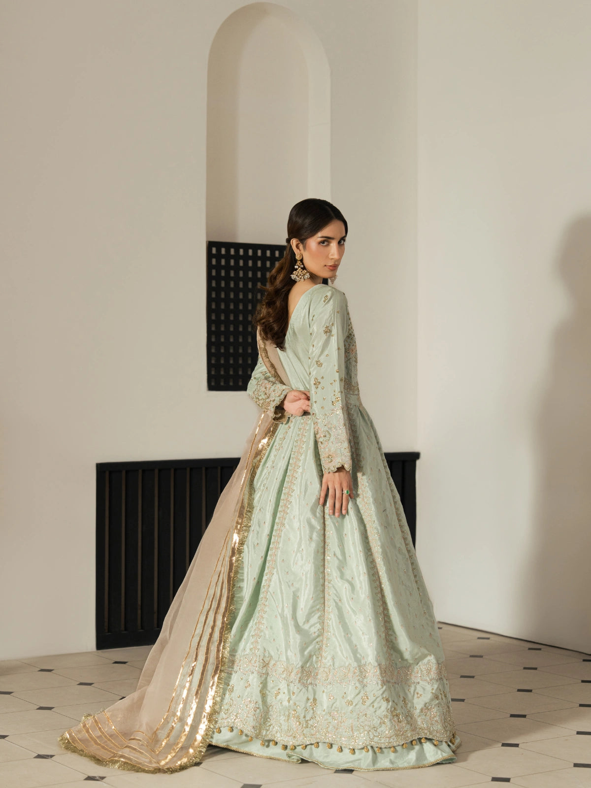 Women's mint green maxi featuring a fitted embroidered bodice and flared skirt.