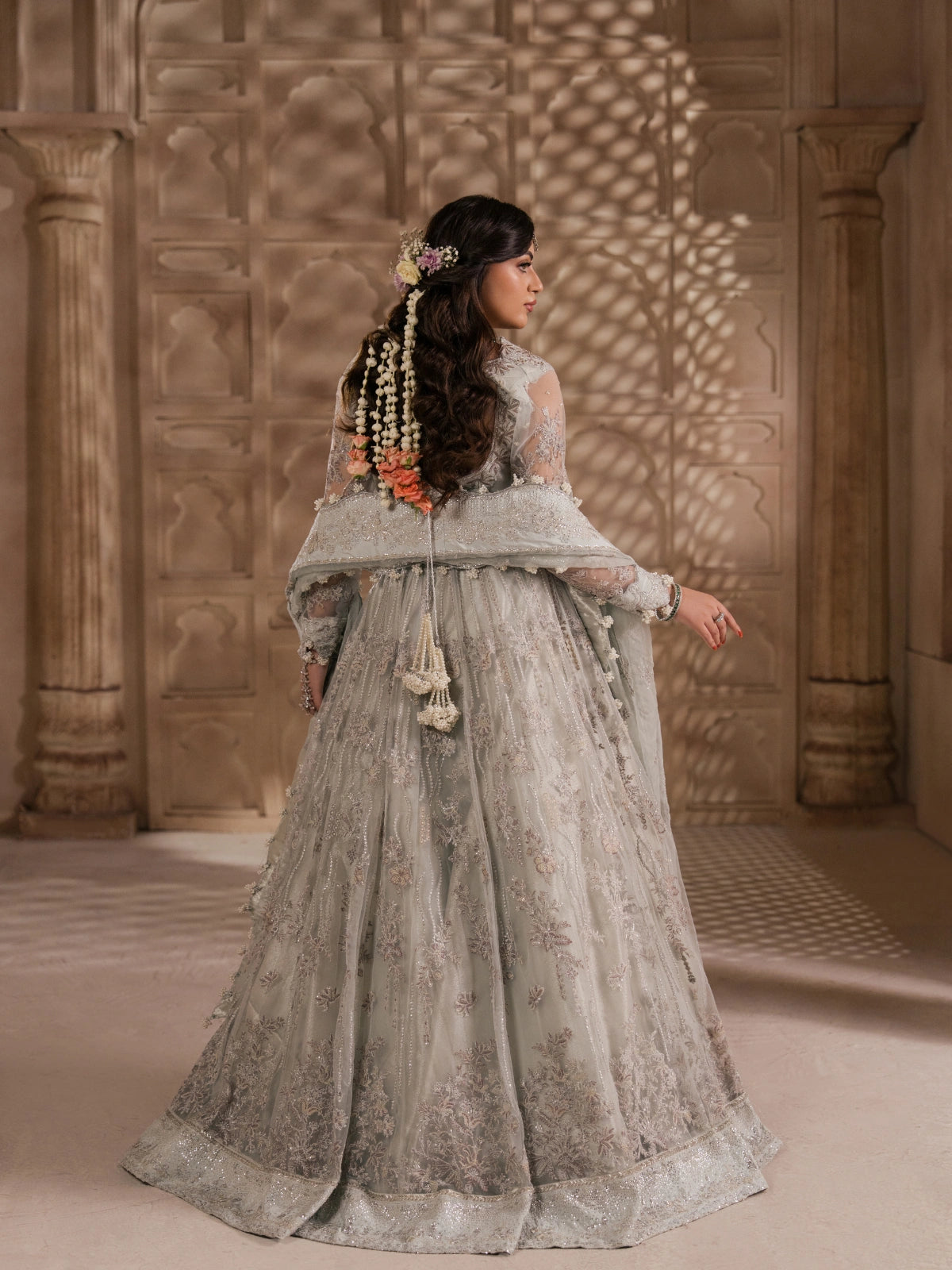 Elegant pearl grey wedding outfit with a heavily embroidered blouse