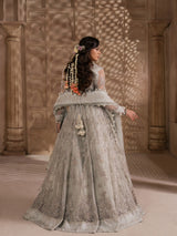 Elegant pearl grey wedding outfit with a heavily embroidered blouse