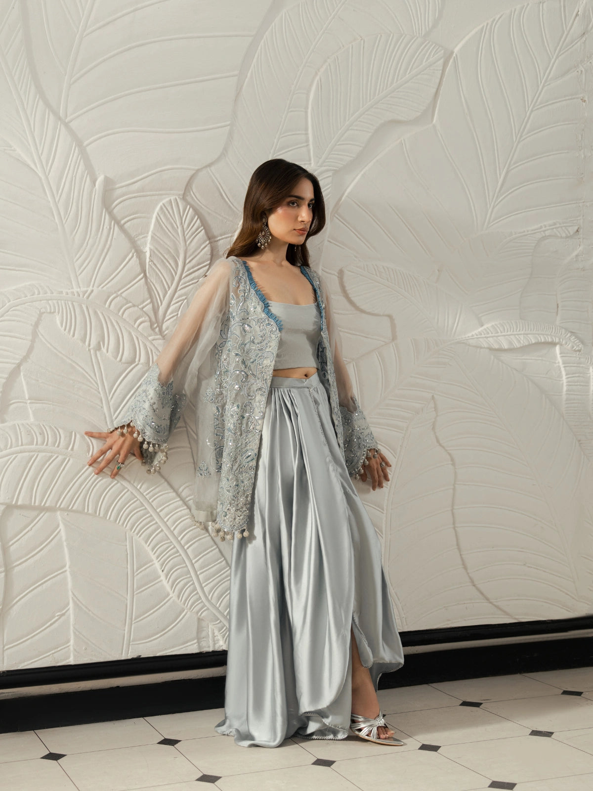 Women's silver grey festive outfit with intricate embroidery and sheer sleeves.