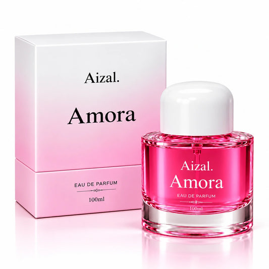 A 100ml bottle of Amora Eau de Parfum with vibrant pink liquid and a white cap, displayed next to its white and pink gradient box on a clean white background.