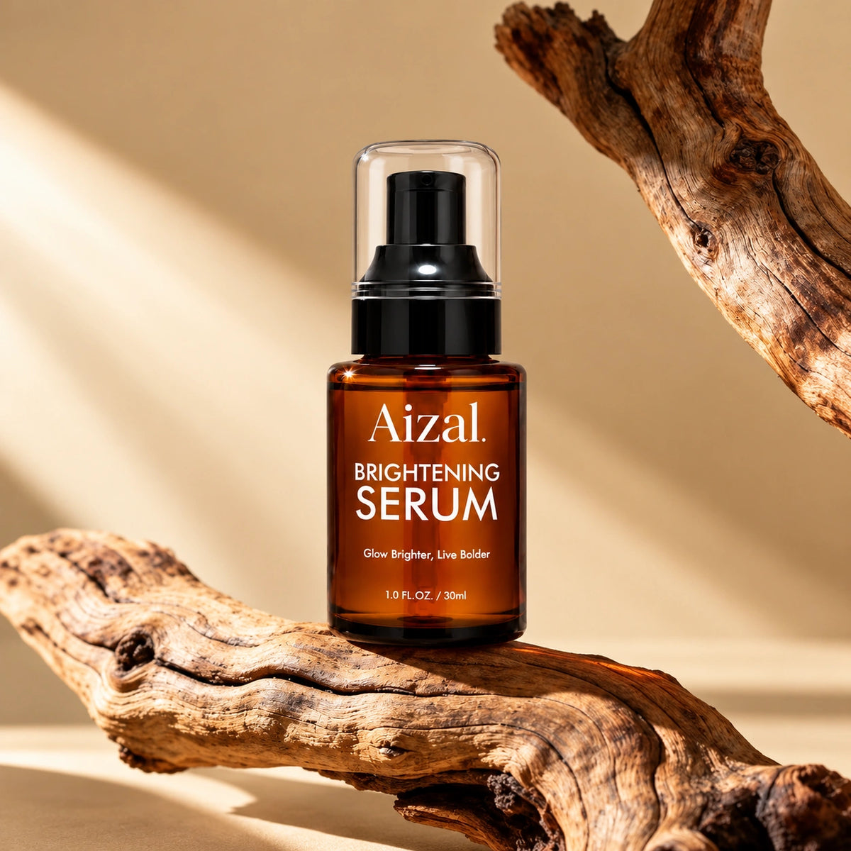Brightening Serum in an amber glass bottle with a black pump and clear cap, displayed on a piece of driftwood against a warm beige background.