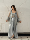 Elegant grey satin outfit with an embellished cape and matching trousers.