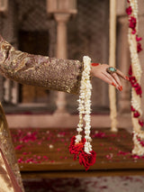 Golden embroidered gharara styled with traditional bridal jewelry