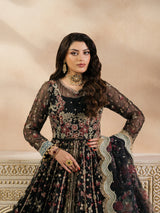 Luxury black and teal bridal lehenga displayed in a beige studio