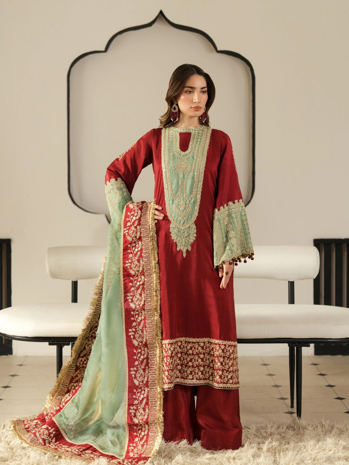 Maroon embroidered women's 3-piece suit with mint green dupatta and intricate gold detailing.