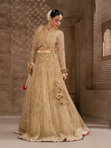 Pakistani bridal dress in champagne gold with intricate embellishments