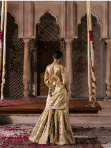 Elegant gold wedding dress with an intricately embellished long dupatta