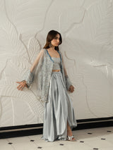Women's silver grey festive outfit with intricate embroidery and sheer sleeves.